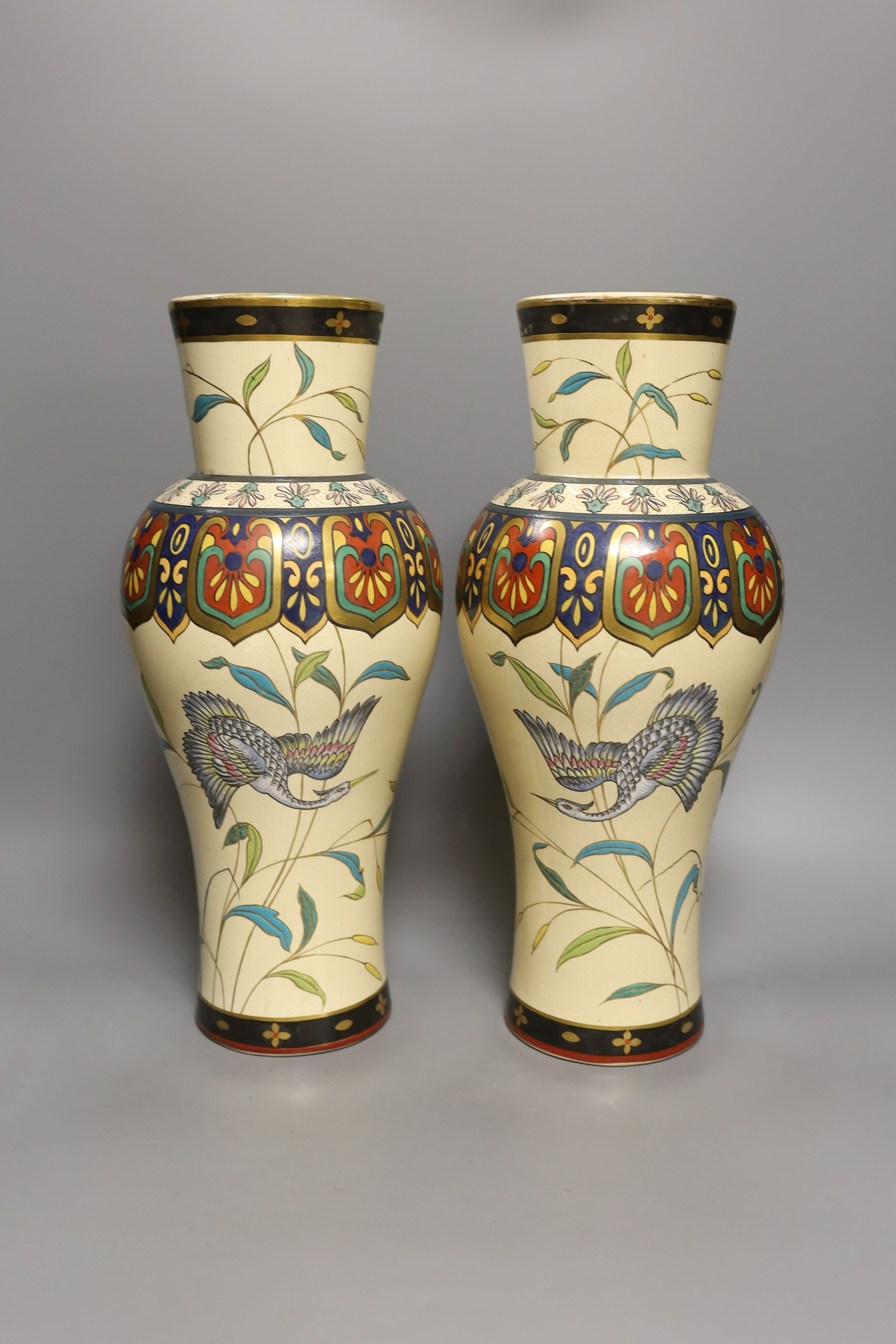 A large pair of Japonaise phoenix decorated baluster vases, 38 cms high.